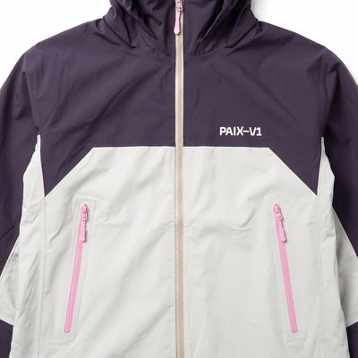 Close-up of the PAIX-V1 PINK CODE 007 jacket: PAIX-V1 logo, pink pocket zips and beige front zip