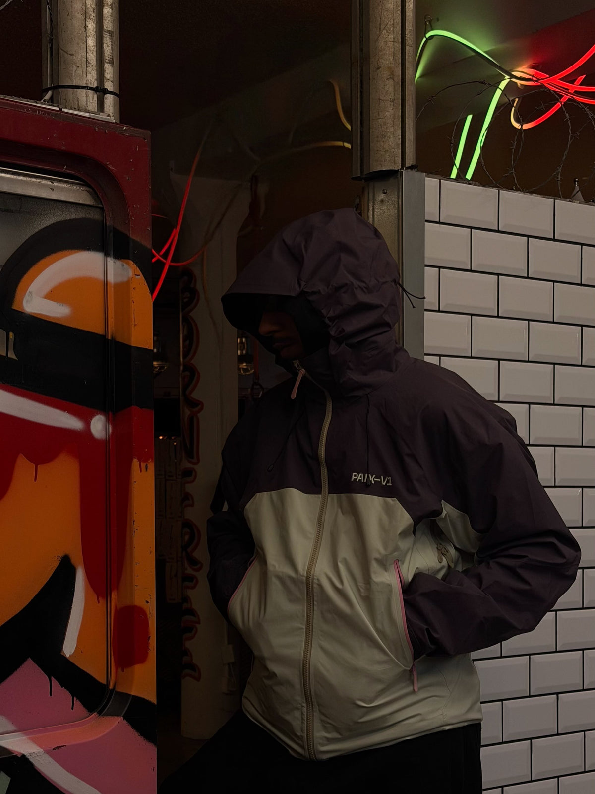 The PINK CODE 007 jacket worn on the street