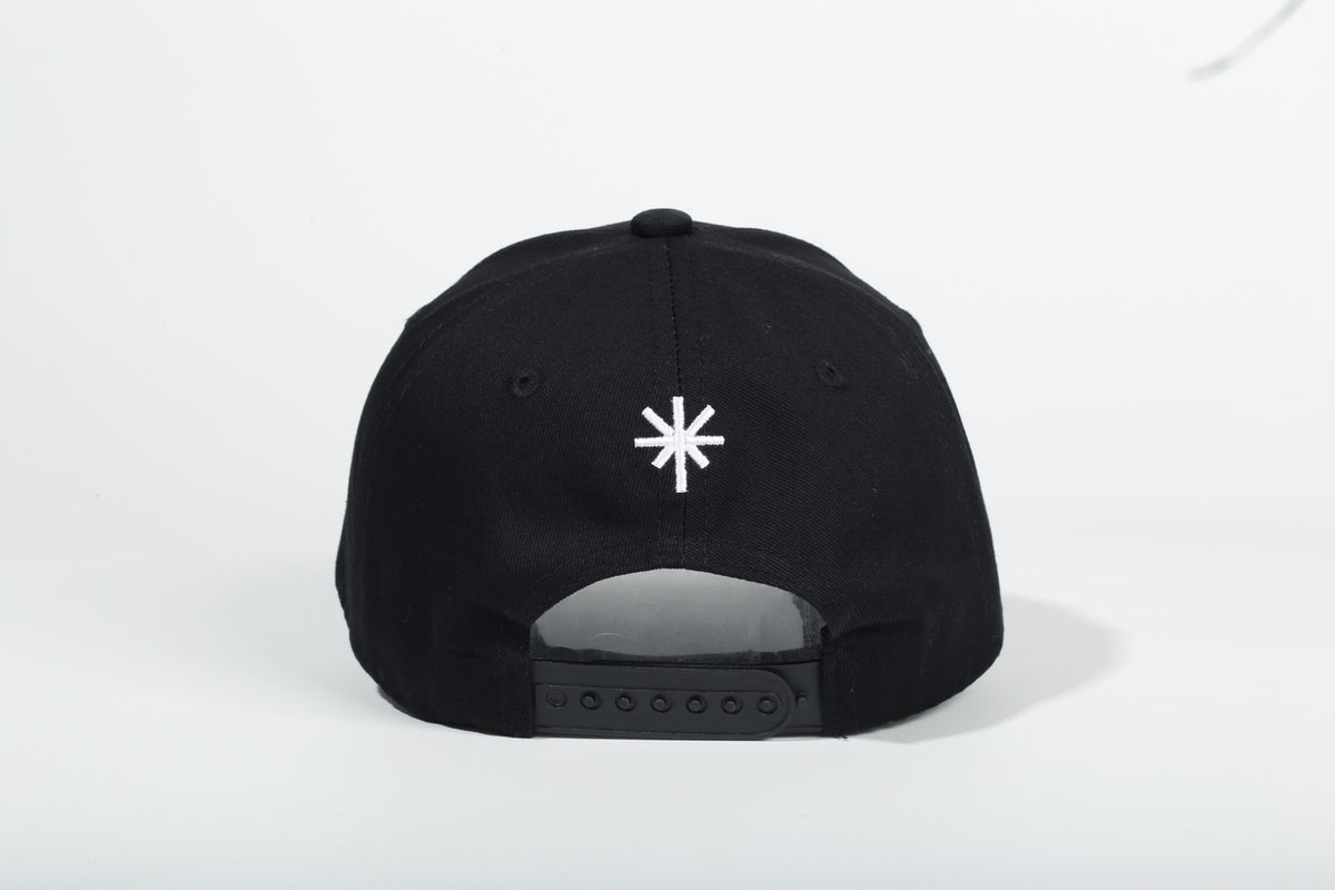 PAIX-V1 cap back view with white embroidered symbol and adjustable snap closure